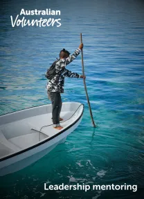 The cover page of the linked document. It includes the Australian Volunteers logo, and the title of the document: 'Leadership mentoring'. The background image is of man standing at the bow of a small boat, using a long stick to move the boat through the water.