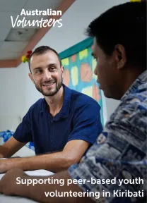 The cover page of the linked document. It includes the Australian Volunteers logo, and the title of the document: 'Supporting peer-based youth volunteering in Kiribati'. The background image is of two people in conversation.